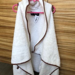 I have a super cute furry vest. ❤️❤️❤️